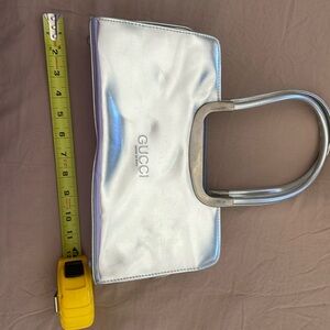 Gucci metallic silver purse.. very cute and stylish.